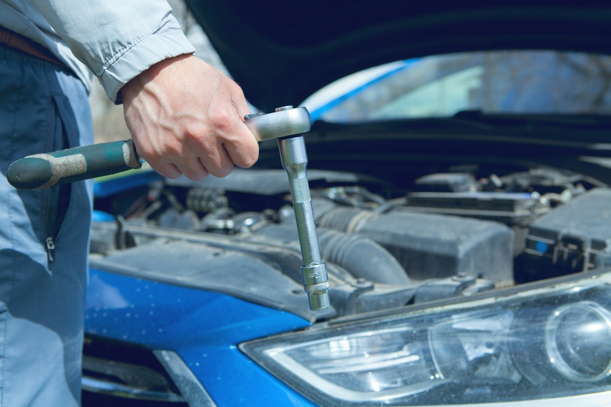 Mechanic checking a vehicle during routine maintenance